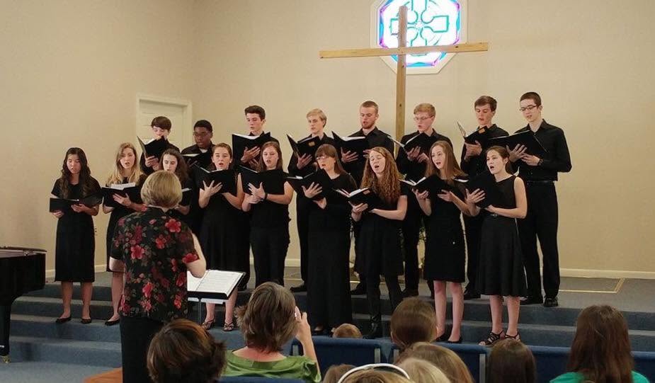 Mrs. Blanchard directing a choir