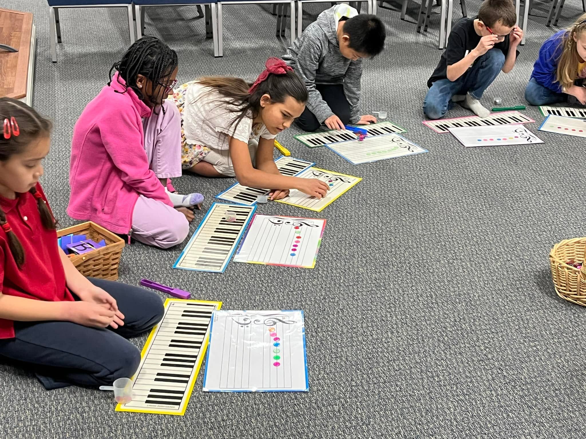 Students practicing music theory in a group class