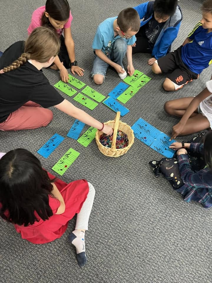 Children learning music through a group game