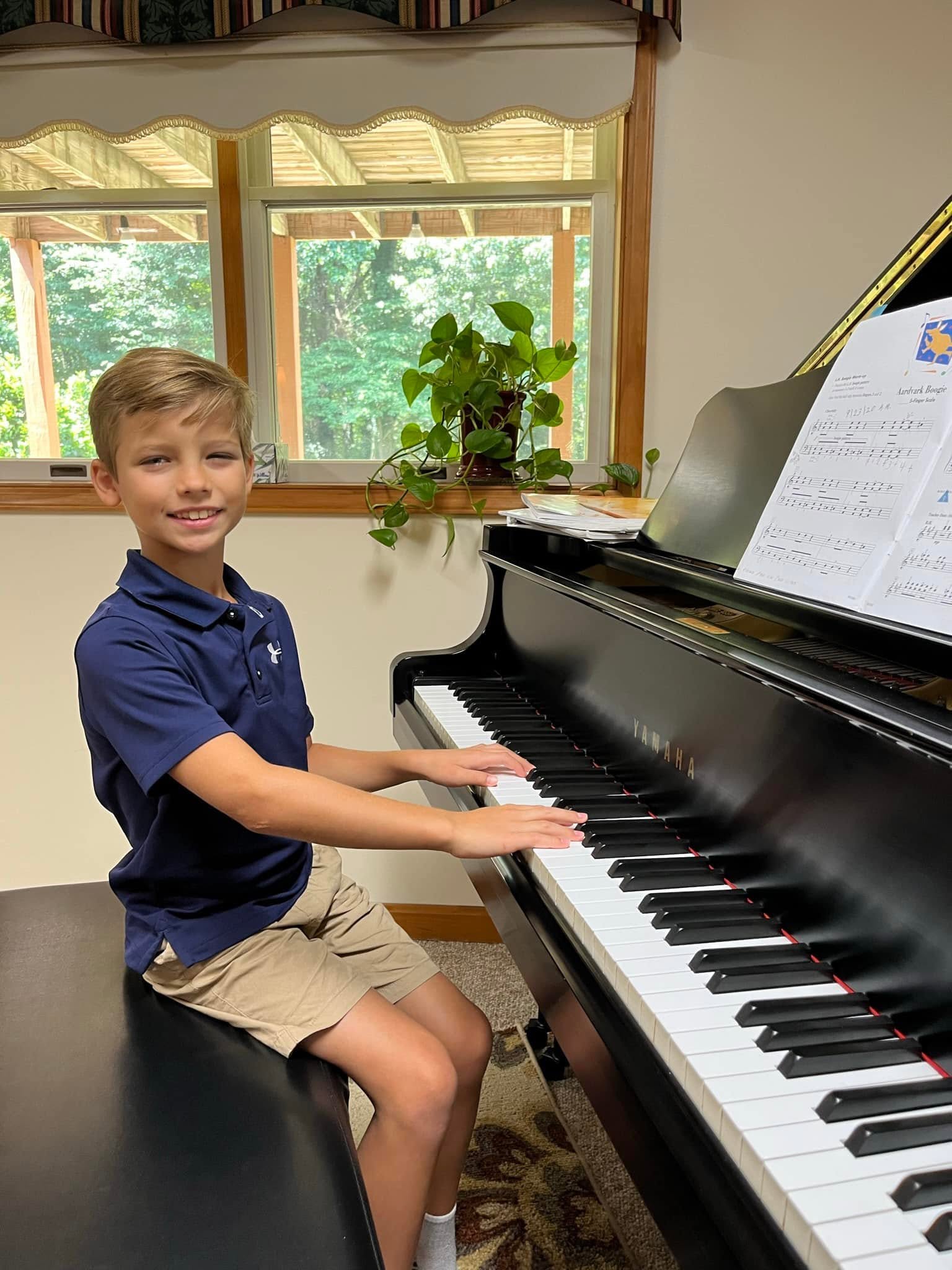 A young pianist at the studio piano