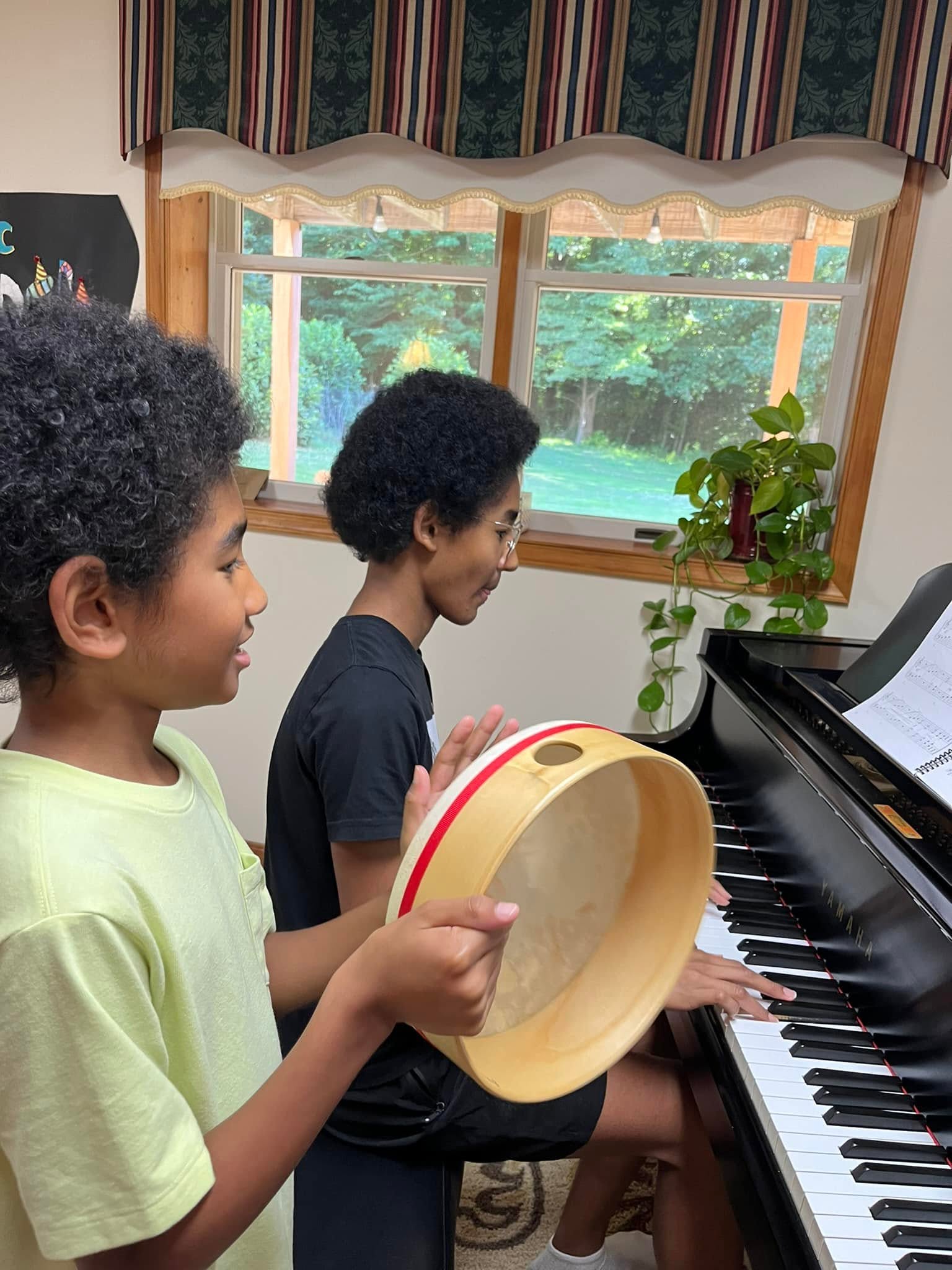 A piano duet with hand drum accompaniment
