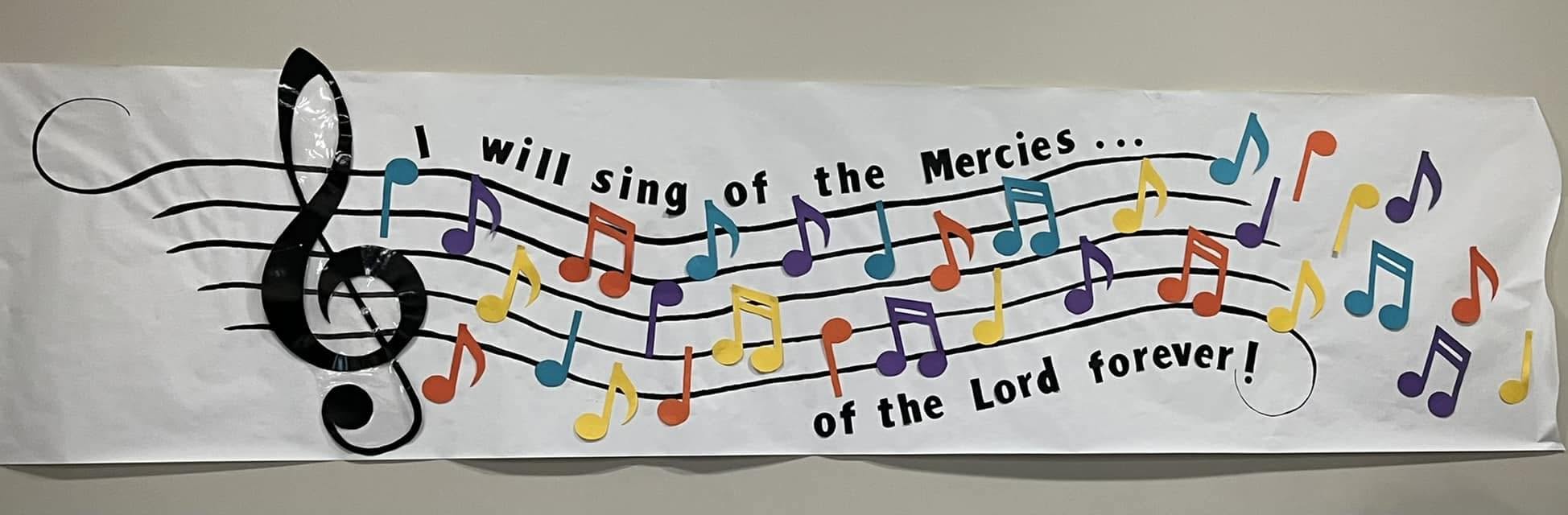 A colorful banner reading I will sing of the mercies of the Lord forever